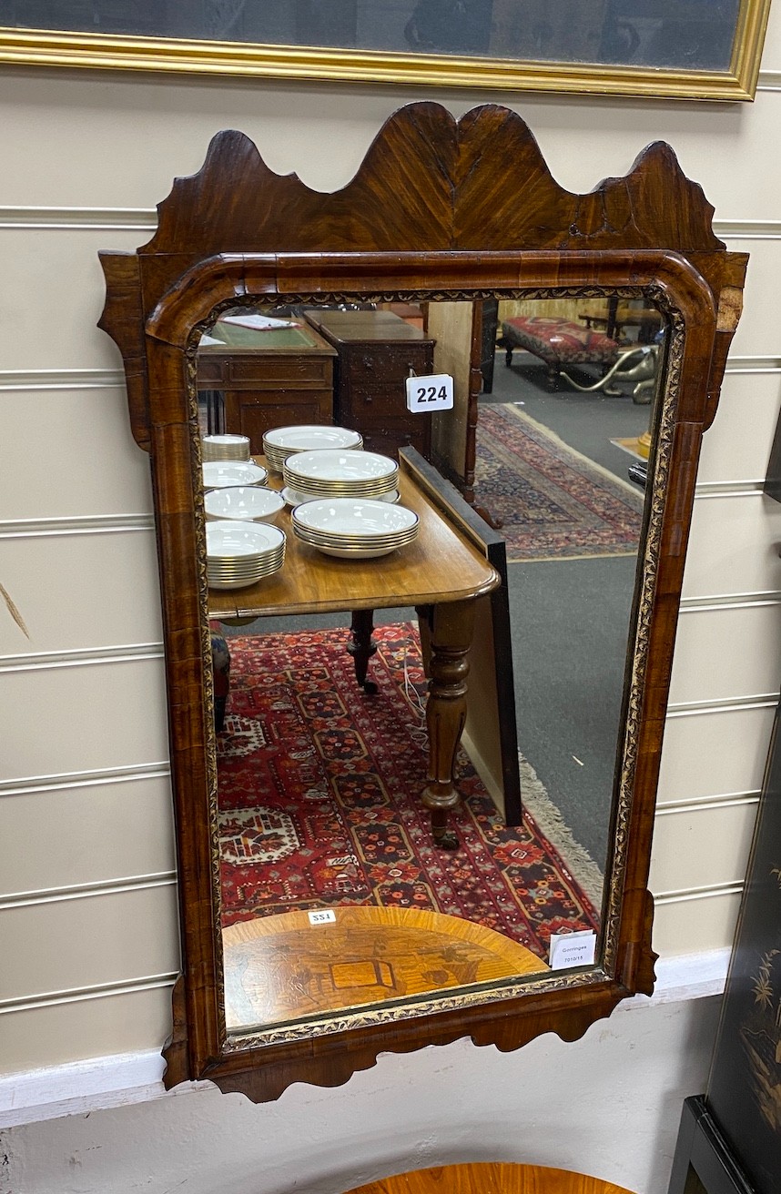 An 18th century walnut fret cut wall mirror, width 45cm, height 80cm